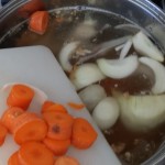 adding the veggies to the nutritious bone broth